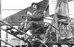 Samuel Franklin Cody, seated in one of his biplanes