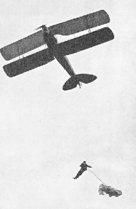 JUMPING FROM LESS THAN 300 FEET, Carl Siemendl demonstrated a new type of parachute in July 1938