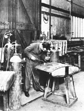 A AIRCRAFT PETROL TANK being built by welding the sections together