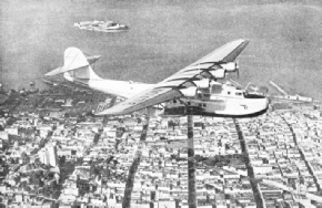 THE CHINA CLIPPER FLYING OVER SAN FRANCISCO, California, at the start of a flight to Manila