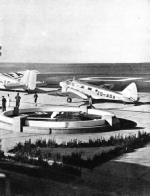 AIRCRAFT IN FRONT OF THE BUILDINGS AT THE RAND AIRPORT