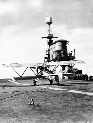 CABLES PULL UP THE AIRCRAFT after it has landed on the deck of an aircraft carrier