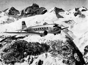 A SWISSAIR MACHINE FLYING NEAR ST. MORITZ AERODROME