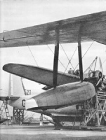 THREE PAIRS OF WHEELS are attached to the hull of a flying boat to enable the aircraft to be pulled out of the water and up the slipway