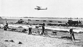 A SECTION OF CROYDON AIRPORT being levelled by hand