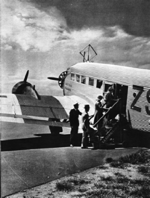 PASSENGERS BOARDING ONE OF THE JUNKERS AIR LINERS of South African Airways