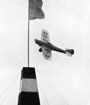 ROUNDING A PYLON in the 1936 King's Cup Air Race