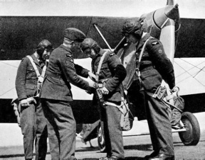 FITTING PARACHUTES on RAF apprentices before their first flight