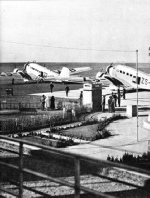 AIRCRAFT IN FRONT OF THE BUILDINGS AT THE RAND AIRPORT