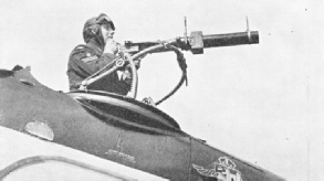 CHECKING THE SIGHTS OF A GUN in the observer’s cockpit 