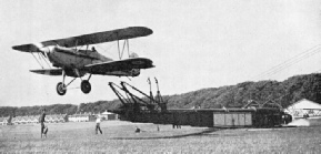 THE TROLLEY IS AUTOMATICALLY STOPPED when it reaches the end of the runway on the catapult and the aeroplane is released