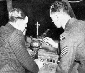 INDOOR PRACTICE FOR BOMB DROPPING in the Auxiliary Air Force