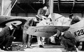 Aircraftmen adjusting the tail unit of a No. 601 (County of London Squadron) machine 