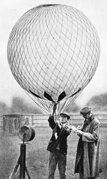 CAPTIVE BALLOONS have been used to carry scientific instruments up into the fog at Kew Gardens, Surrey