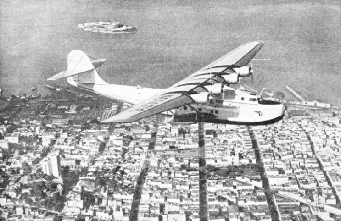 THE CHINA CLIPPER FLYING OVER SAN FRANCISCO, California, at the start of a flight to Manila