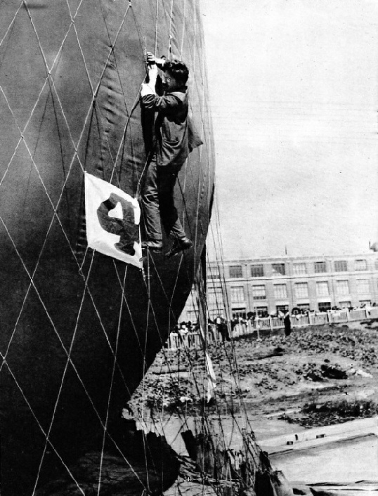 MAKING ADJUSTMENTS TO THE NET of a balloon before attaching the basket