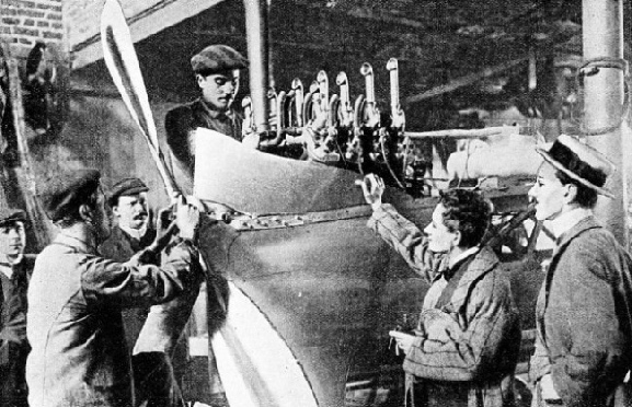 MECHANICS AT WORK ON LATHAM’S MACHINE, Rheims 1909