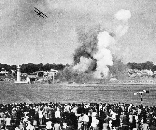 AEROPLANES DEMOLISHING A SET PIECE at the 1937 Hendon air display