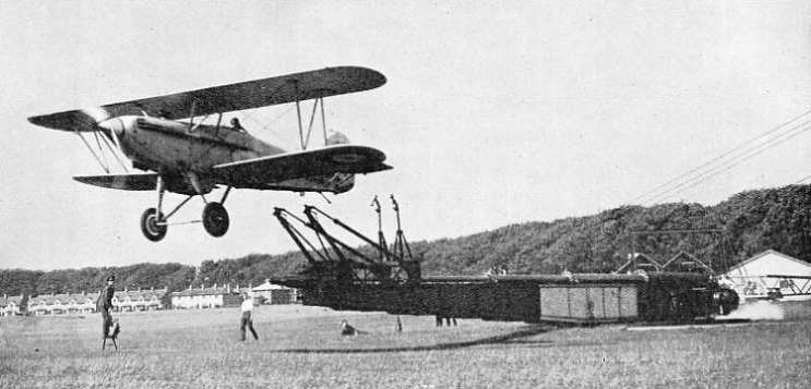 THE TROLLEY IS AUTOMATICALLY STOPPED when it reaches the end of the runway on the catapult and the aeroplane is released