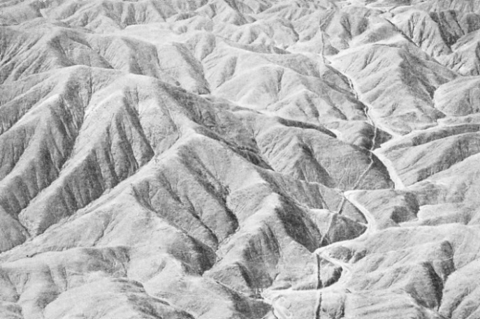 DISCOVERED BY AIR. This wall, running alongside the dry bed of a tributary of the River Santa, Peru