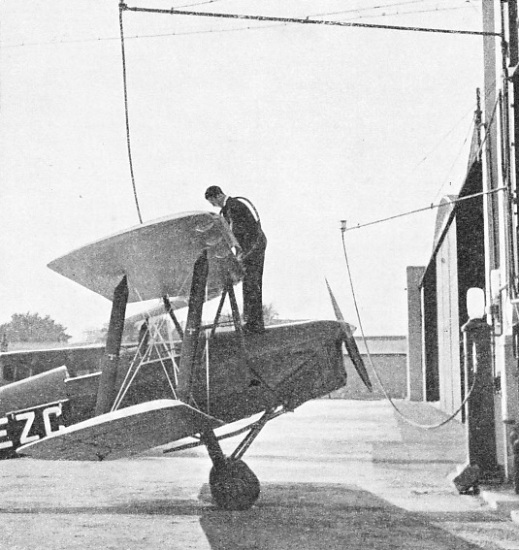 FILLING UP WITH PETROL outside a hangar at Brooklands Aerodrome, Surrey