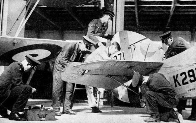 Aircraftmen adjusting the tail unit of a No. 601 (County of London Squadron) machine 
