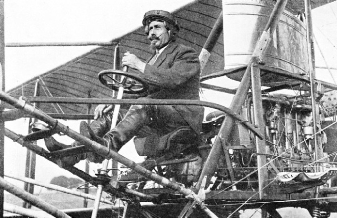 Samuel Franklin Cody, seated in one of his biplanes