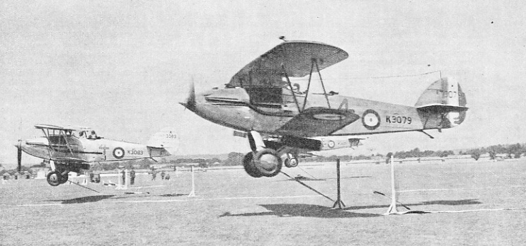 MESSAGES BEING PICKED UP by aircraft of No. 4 Army Co-operation Squadron at the Hendon air display